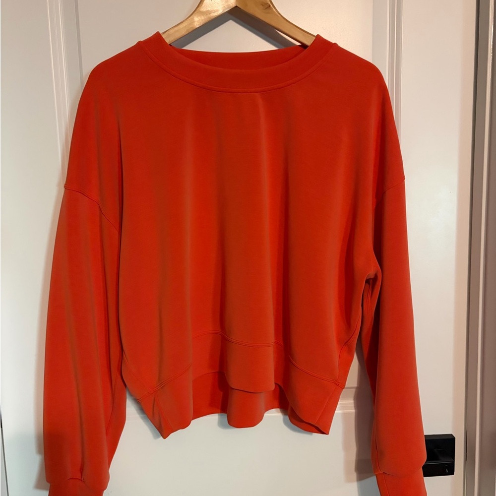 Lululemon Vibrant Orange Sweatshirt. Crop style fit, hits at waist.